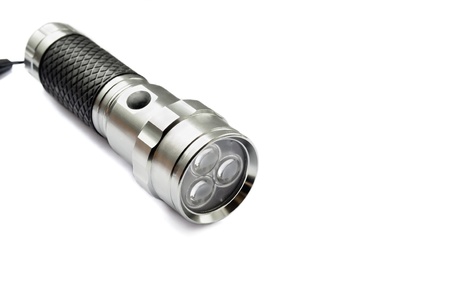 Metal flashlight isolated on white backgroundの写真素材