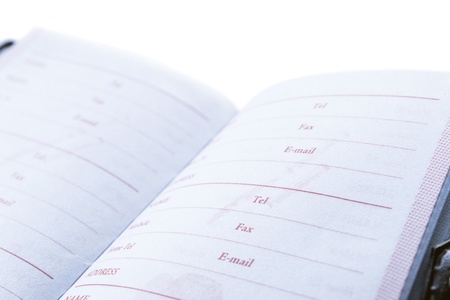 Blank opened phone book on white backgroundの写真素材