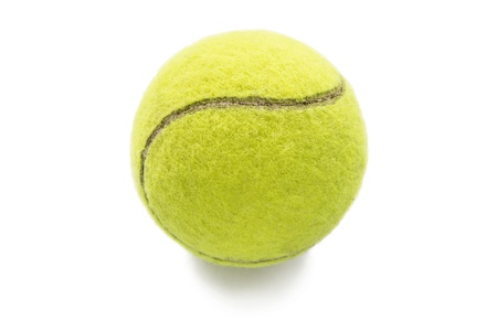 Yellow tennis ball isolated over whiteの写真素材