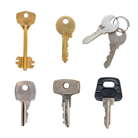 Set of old keys isolated over white backgroundの写真素材