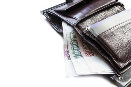 Leather wallet with credit cards and rouble banknotes of different values isolated over whiteの写真素材