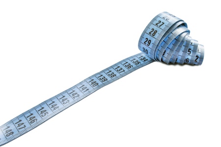 Rolled up centimeter measuring tape isolated over whiteの写真素材