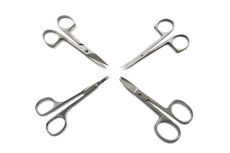 Set of four different manicure scissors isolated over white backgroundの写真素材