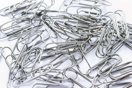 A lot of metal paper clips closeupの写真素材