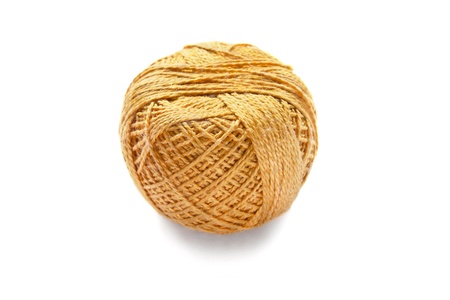Ball of silky yellow yarn isolated over whiteの写真素材