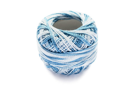 Ball of bicolor blue yarn isolated on white background
