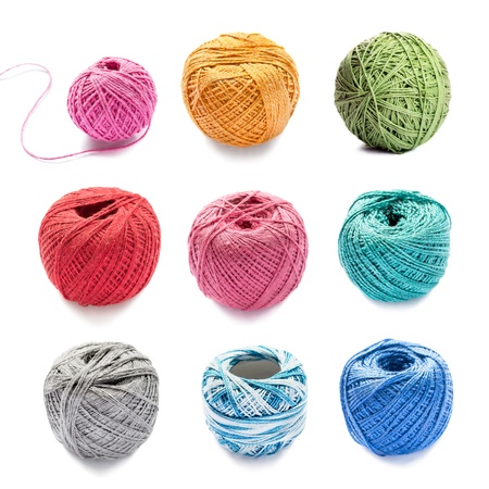 Set of nine balls of multicolor yarn isolated on white backgroundの写真素材