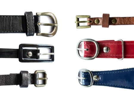 Set of six different leather belts isolated on white backgroundの写真素材