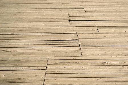 Old gray wooden decking perspective as a backgroundの写真素材