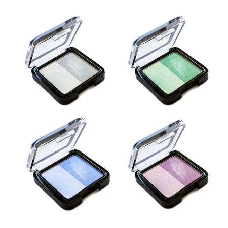 Set of four bicolor eyeshadows in little boxes isolated over whiteの写真素材