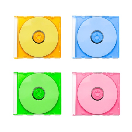 Set of multicolor compact discs in plastic boxes on white backgroundの写真素材