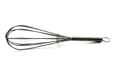 Metal manual egg whisk on whita backgroundの写真素材