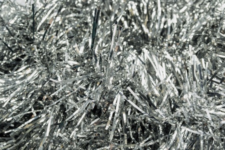 Garlands of silver christmas tree tinsel as a backgroundの写真素材
