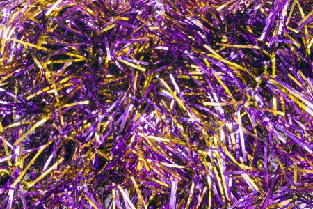 Garlands of violet christmas tree tinsel as a backgroundの写真素材