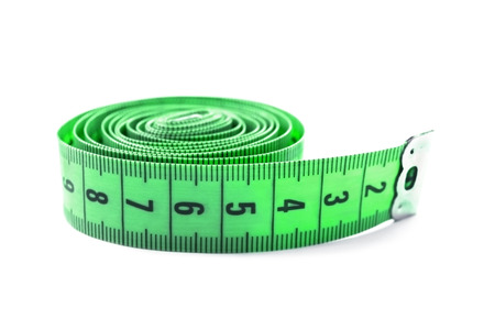 Green centimeter measuring tape on white backgroundの写真素材