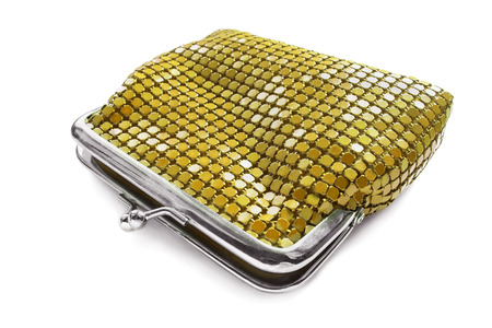 Half opened golden glossy metal purse isolated over whiteの写真素材
