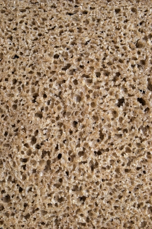 Texture of spongy brown rye bread closeupの写真素材