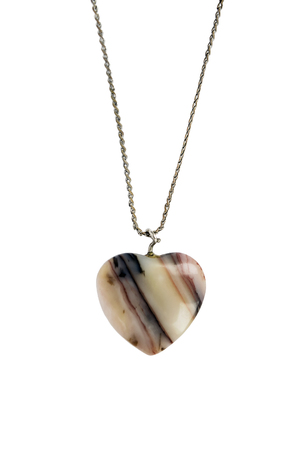 Simple agate pendant in the shape of a heart on white backgroundの写真素材