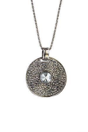 Big round silver medallion with crystal isolated over whiteの写真素材
