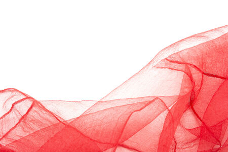 Drapery of crumpled transparent red nylon as a backgroundの写真素材