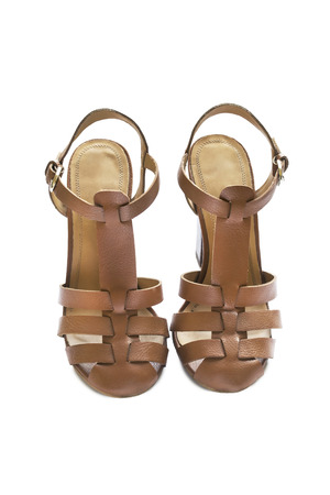 Brown leather slingbacks isolated over whiteの写真素材
