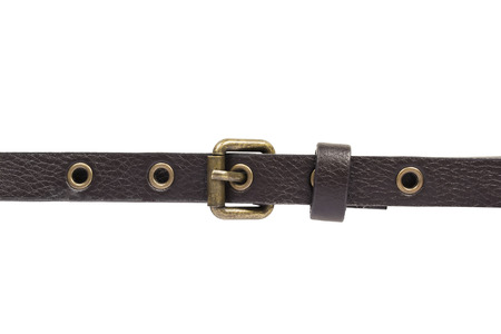 Brown leather belt with golden buckle on white backgroundの写真素材