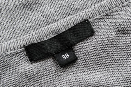 Gray knitted cloth with black 38 size label