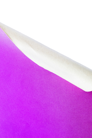 Purple sheet of paper rolled over white as a backgroundの写真素材