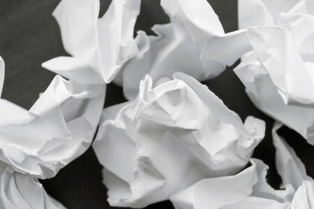 A lot of crumpled white paper as a backgroundの写真素材
