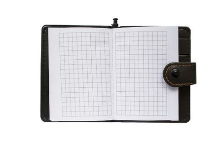 Opened blank leather bound notepad with squared sheets isolated over whiteの写真素材
