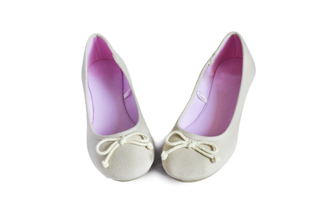 Beige textile flat shoes on white backgroundの写真素材