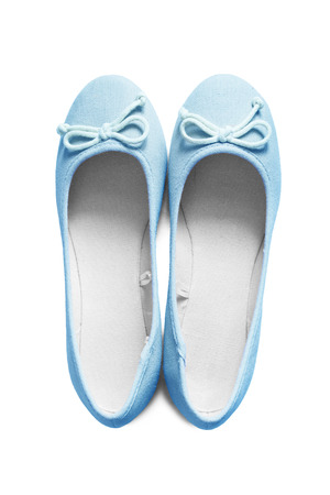 Pair of blue cotton ballet shoes on white backgroundの写真素材