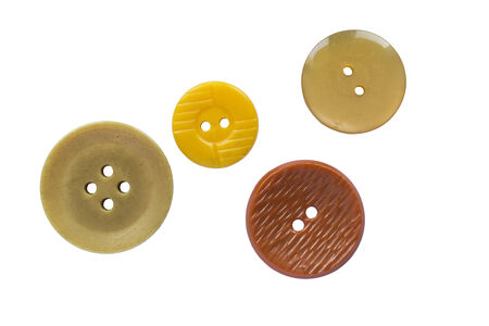 Set of four glass and plastic buttons on white backgroundの写真素材