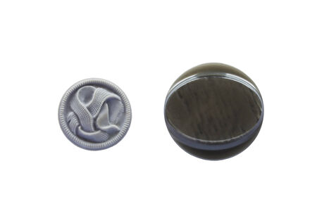 Two gray plastic buttons isolated over whiteの写真素材