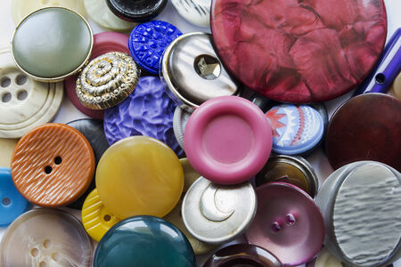 Different multicolor buttons closeup as a backgroundの写真素材