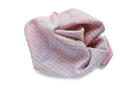 Pink squared crumpled handkerchief on white の写真素材