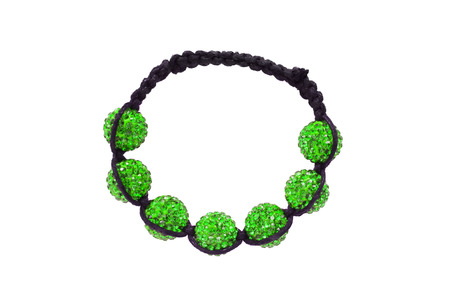 Bracelet talisman with green crystal beads and black lace isolated over whiteの写真素材