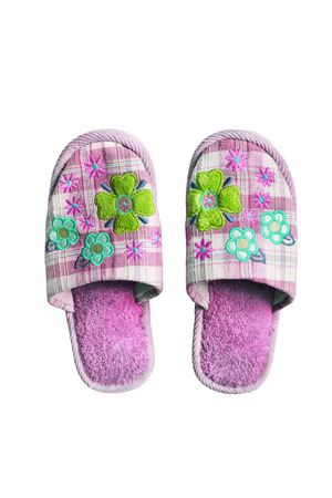Pair of pink textile home slippers isolated over whiteの写真素材