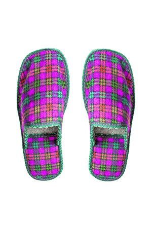 Pair of  pink home wool slippers on white backgroundの写真素材
