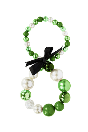 Elegant bracelet with white pearl and green beads isolated over whiteの写真素材