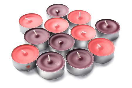Group of tea lights in shades of pink on white backgroundの写真素材