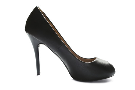 Black leather high heeled shoe on white backgroundの写真素材