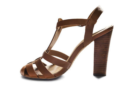 Brown leather high heeled slingback shoe on white backgroundの写真素材