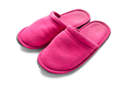 Pair of pink slippers on white background closeupの写真素材