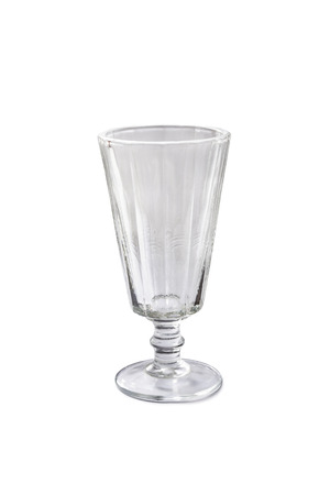 Vintage empty faceted wineglass isolated over whiteの写真素材