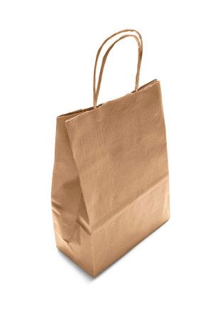 Beige kraft paper bag isolated over whiteの写真素材