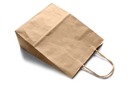 Blank beige kraft paper bag on white backgroundの写真素材