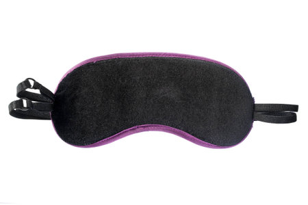 Black velvet sleeping mask isolated over whiteの写真素材