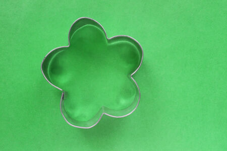 Silhouette of a flower on green fabric as a backgroundの写真素材