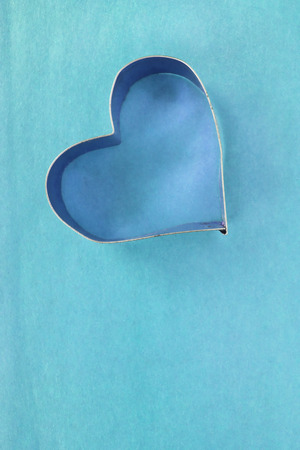 Silhouette of a heart on blue backgroundの写真素材